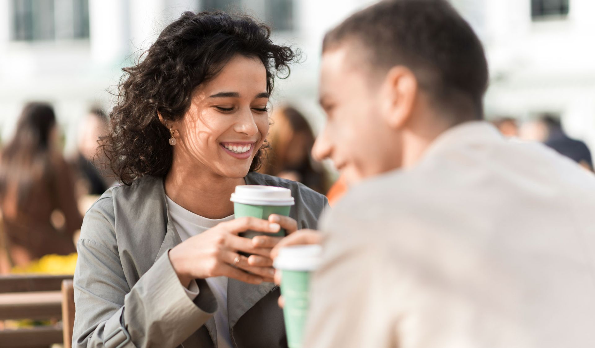 Woman holding Disposable Coffee Cup